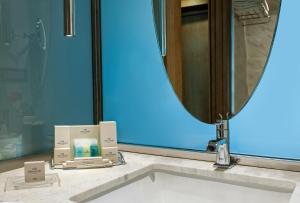 a bathroom with a sink and a mirror at Elite World Marmaris - Adult Only in Marmaris