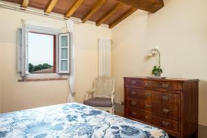 A bed or beds in a room at Tenuta di Rota