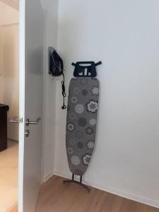 a snowboard hanging on a wall next to a door at Old town Apartments , Perfekt für Messe 15min in Düsseldorf