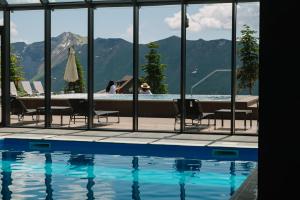 a swimming pool with a view of a mountain at Gudauri Lodge in Gudauri