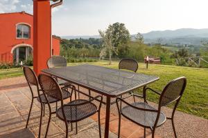 a table and chairs sitting on a patio at Tenuta di Rota in Reggello