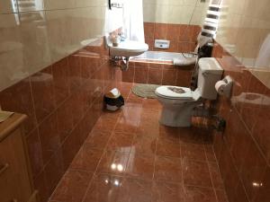 a bathroom with a toilet and a sink at Private room in Valletta