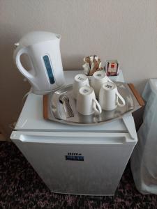 Kemudahan buat kopi dan teh di Rooms Diana