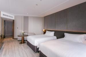 Ein Bett oder Betten in einem Zimmer der Unterkunft Centara Grand At CentralWorld