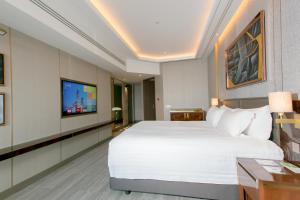 Ein Bett oder Betten in einem Zimmer der Unterkunft Centara Grand At CentralWorld
