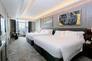 Ein Bett oder Betten in einem Zimmer der Unterkunft Centara Grand At CentralWorld