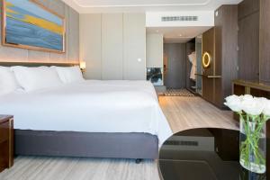 Ein Bett oder Betten in einem Zimmer der Unterkunft Centara Grand At CentralWorld