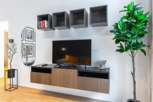 تلفاز و/أو أجهزة ترفيهية في Trendy apt with - smart TV, coffee machine in Meidling