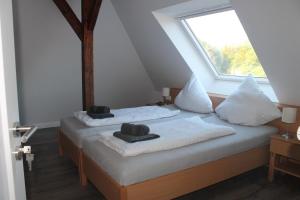 A bed or beds in a room at Tempel-inn Appartements Molkereistr. 2