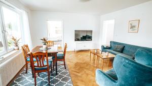 a living room with a couch and a table at Byggmästare Villan in Motala