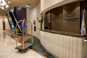 a lobby with a luggage cart in a building at Howard Johnson Plaza by Wyndham Buenos Aires Florida Street in Buenos Aires