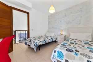 Łóżko lub łóżka w pokoju w obiekcie Villa Paula Costa Teguise