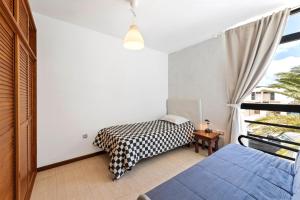 Łóżko lub łóżka w pokoju w obiekcie Villa Paula Costa Teguise