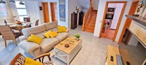 a living room with a couch and a table at CASA BALIMAR in Tarajalejo