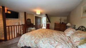 Кровать или кровати в номере Magnolia Cottage