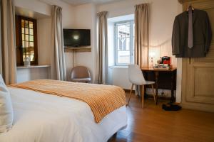 Postel nebo postele na pokoji v ubytování Le Hameau d'Eguisheim - Chambres d'hôtes & Gîtes
