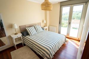 Ένα ή περισσότερα κρεβάτια σε δωμάτιο στο Apartamento La Bolisa
