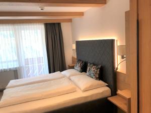 Posteľ alebo postele v izbe v ubytovaní Hotel Garni Central - Zimmer - Studios - Apartments