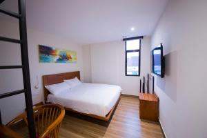 Letto o letti in una camera di The Point Boutique Hotel