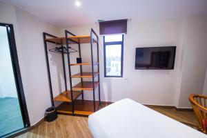 Letto o letti in una camera di The Point Boutique Hotel