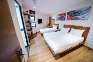 Letto o letti in una camera di The Point Boutique Hotel