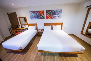 Letto o letti in una camera di The Point Boutique Hotel