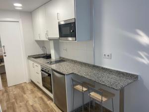Kuchyňa alebo kuchynka v ubytovaní Apartamentos OLIVA