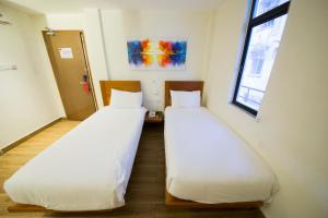 Letto o letti in una camera di The Point Boutique Hotel