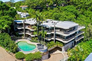 an aerial view of a building with a swimming pool at Tranquil Noosa at its best Beach, Bush, Good Food. in Noosa Heads
