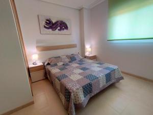 Postel nebo postele na pokoji v ubytování ACV - Playa Dorada-1ª Linea Planta 5 Norte