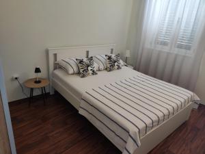 Posteľ alebo postele v izbe v ubytovaní Apartment Dalma