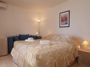 a bedroom with a large bed with two towels on it at Diklo beach apartments 1 in Zadar