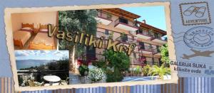 a picture of a hotel with a sign in front of it at VASILIKI SeaMemories in Barbati