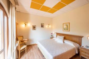 Postel nebo postele na pokoji v ubytování Hotel Pineta Campi