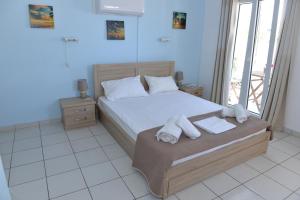 Postel nebo postele na pokoji v ubytování Blue Rooms
