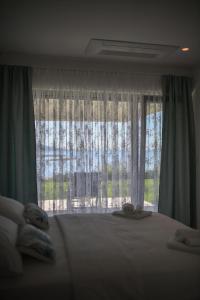 Postel nebo postele na pokoji v ubytování "Babe" Beachfront Residence