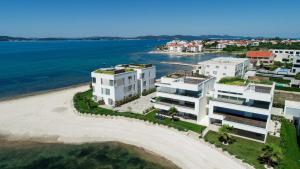 an aerial view of a building on a beach at "Babe" Beachfront Residence in Sukošan