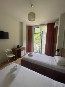Postel nebo postele na pokoji v ubytování Villa Flora