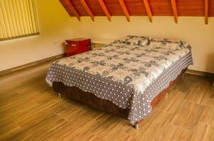 Un pat sau paturi într-o cameră la Lagos de Pilacá