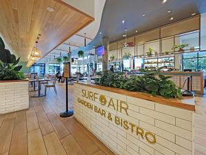 a restaurant with a sign that reads stuff air garden bar and dining at Seaside Stays Marcoola Beach Apartment 1 Bedroom in Marcoola