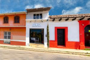 an orange and white building with an omo sign on it at OYO Hotel Punta Guadalupe, San Cristóbal de las Casas in San Cristóbal de Las Casas +66 photos