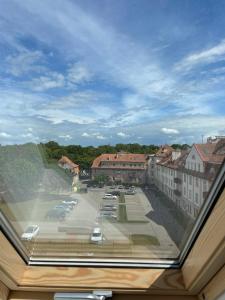 a view from a window of a parking lot at Cosy Studio in the City center with Air conditioneer! in Klaipėda