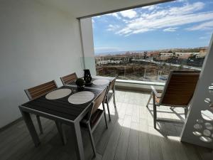 A balcony or terrace at Ocean Garden Sunset Apartment - heated swimming pool Free WIFI