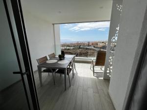A balcony or terrace at Ocean Garden Sunset Apartment - heated swimming pool Free WIFI