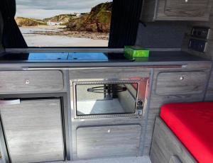 a room with a tv in an rv at ChillDayz in Paignton