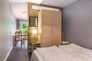 Postel nebo postele na pokoji v ubytování Highland Lodge