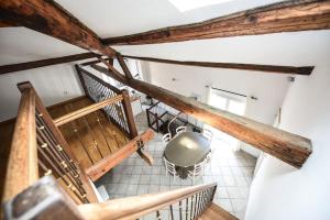 an overhead view of a staircase with a pot on the floor at Sète - LOFT 6 personnes. CENTRE VILLE / PORT in Sète +1 photo