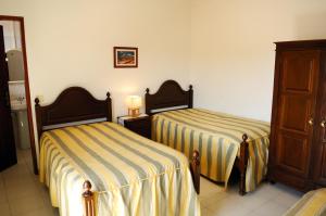 Postel nebo postele na pokoji v ubytování Guesthouse A Lareira