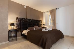 Letto o letti in una camera di Travel Homes - The Ancienne Poste, Petite Venise