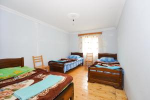 Postel nebo postele na pokoji v ubytování Guesthouse Nora